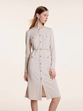 a woman in beige jersey dress